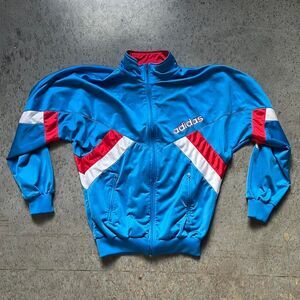Blue and red Adidas track jacket with embroidered logo